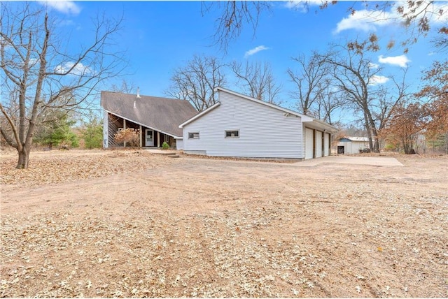 8375 N Bass Lake Rd, Danbury, WI 54830 - view of property exterior featuring driveway
