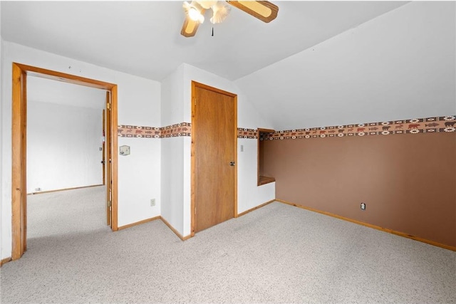 8375 N Bass Lake Rd, Danbury, WI 54830 - additional living space with a ceiling fan, carpet, baseboards, and vaulted ceiling