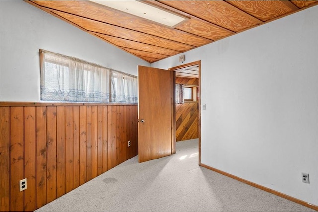 8375 N Bass Lake Rd, Danbury, WI 54830 - carpeted empty room featuring wood walls