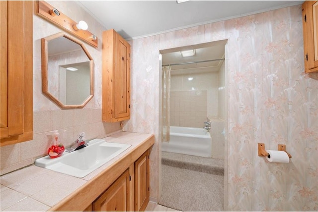 8375 N Bass Lake Rd, Danbury, WI 54830 - bathroom with backsplash, wallpapered walls, vanity, and ornamental molding