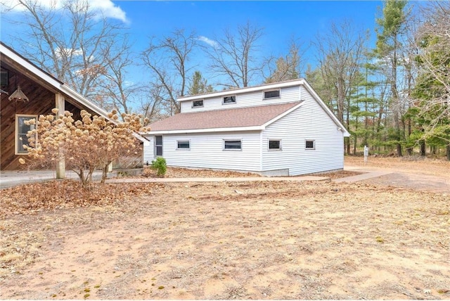 8375 N Bass Lake Rd, Danbury, WI 54830 - rear view of house with roof with shingles