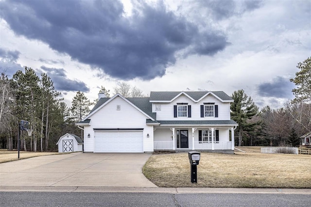 836 Westwind Dr, Black River Falls, WI 54615 - traditional-style house featuring a shed, concrete driveway, a chimney, covered porch, and an attached garage