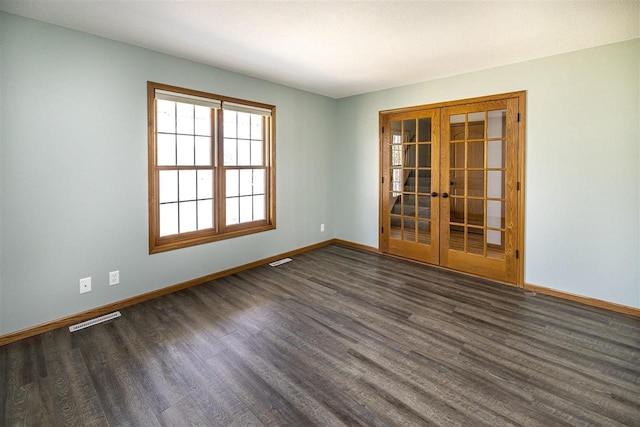 836 Westwind Dr, Black River Falls, WI 54615 - empty room with baseboards, french doors, dark wood-type flooring, and visible vents
