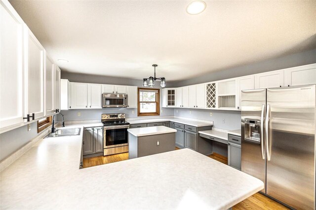 836 Westwind Dr, Black River Falls, WI 54615 - kitchen featuring a sink, an inviting chandelier, recessed lighting, light countertops, and appliances with stainless steel finishes