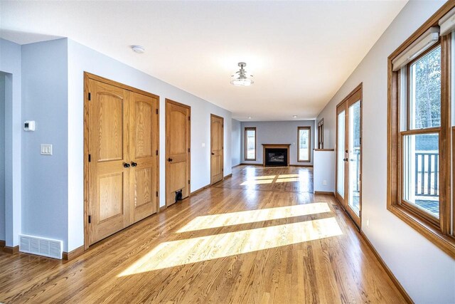 836 Westwind Dr, Black River Falls, WI 54615 - corridor featuring light wood finished floors, baseboards, and visible vents