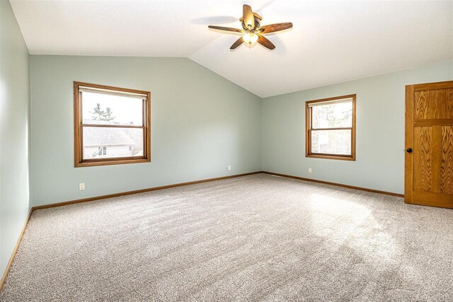 836 Westwind Dr, Black River Falls, WI 54615 - spare room with baseboards, vaulted ceiling, a ceiling fan, and carpet