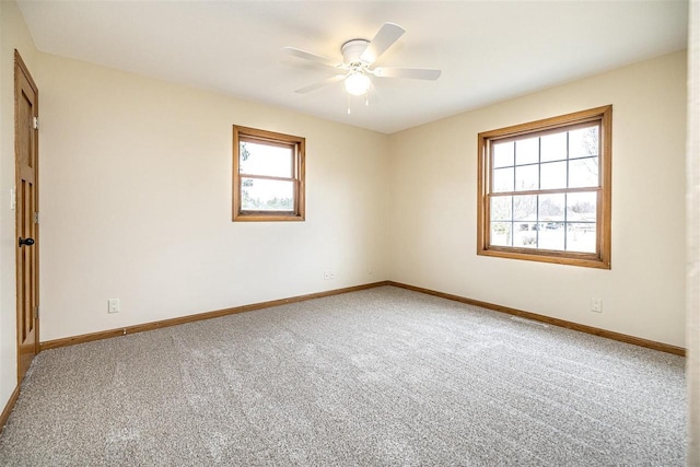 836 Westwind Dr, Black River Falls, WI 54615 - carpeted empty room featuring a ceiling fan, baseboards, and a healthy amount of sunlight