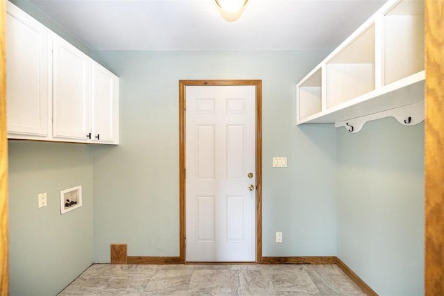 836 Westwind Dr, Black River Falls, WI 54615 - laundry area with baseboards, washer hookup, and cabinet space