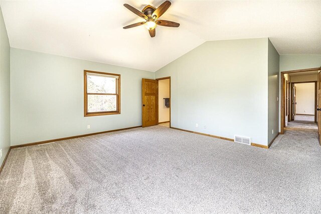 836 Westwind Dr, Black River Falls, WI 54615 - empty room featuring baseboards, visible vents, light colored carpet, lofted ceiling, and ceiling fan