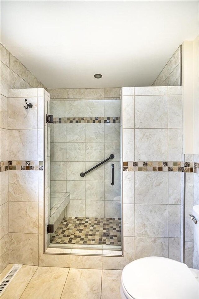 836 Westwind Dr, Black River Falls, WI 54615 - bathroom with a shower stall, visible vents, and toilet