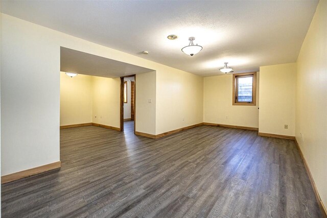836 Westwind Dr, Black River Falls, WI 54615 - unfurnished room featuring baseboards and dark wood-type flooring