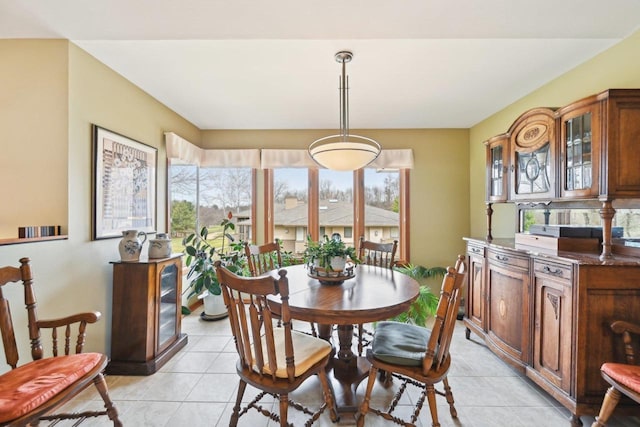 dining area featuring light tile patterned floors