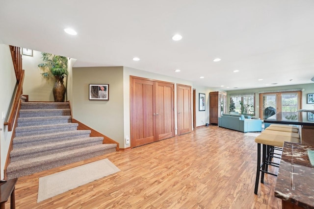 kitchen with open floor plan, light wood-style flooring, and recessed lighting