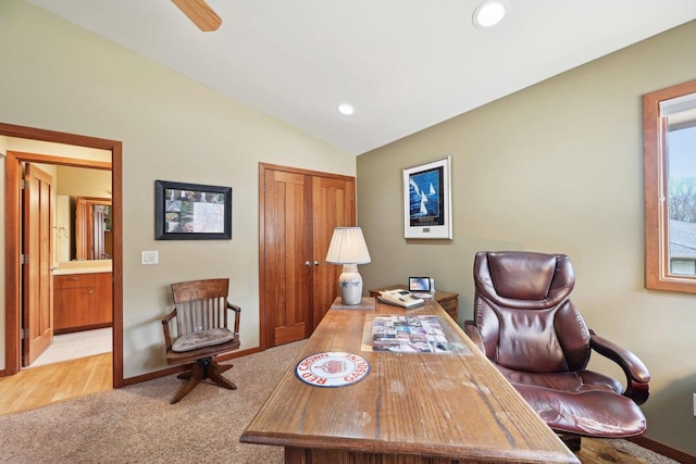 carpeted office featuring lofted ceiling and recessed lighting