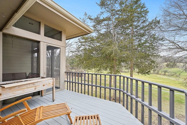 wooden terrace with a yard