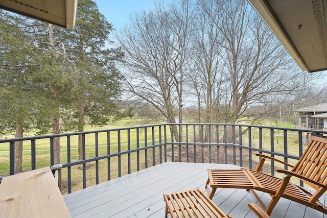 wooden terrace with a lawn