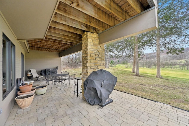 view of patio with grilling area and outdoor dining space