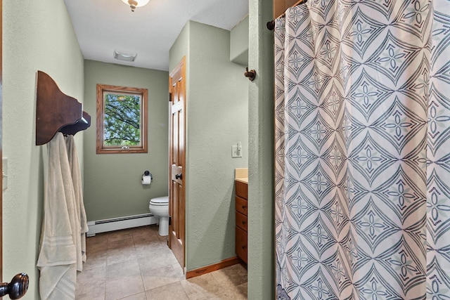 W1260 S Shore Dr, Palmyra, WI 53156 - full bath with tile patterned floors, toilet, vanity, a baseboard radiator, and baseboards