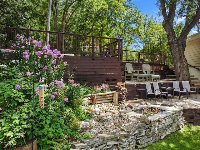 W1260 S Shore Dr, Palmyra, WI 53156 - view of patio featuring a fire pit and a deck