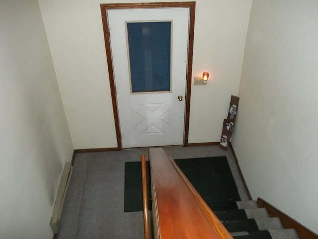 doorway to outside with a baseboard radiator, carpet floors, baseboards, and stairs