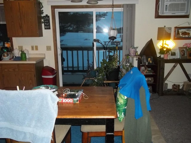 dining room featuring a wall mounted AC