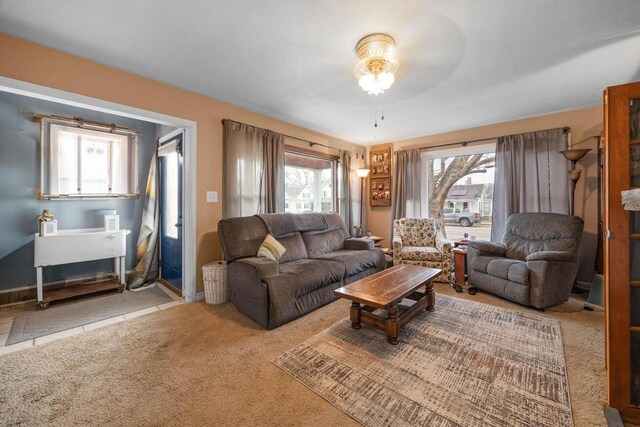 505 S Main St, Edgerton, WI 53534 - carpeted living area featuring a ceiling fan and a healthy amount of sunlight
