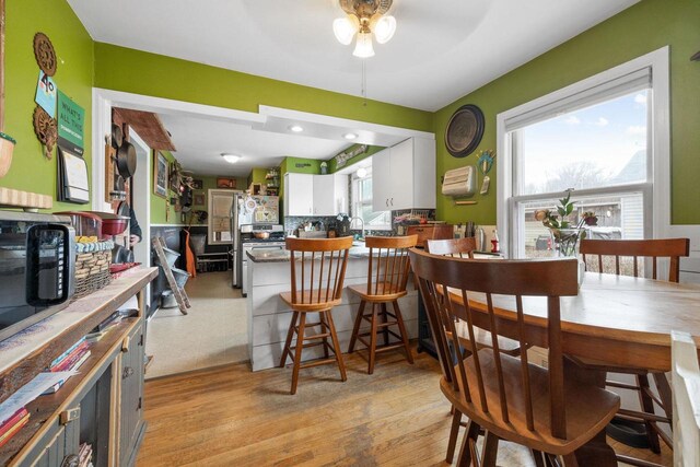505 S Main St, Edgerton, WI 53534 - dining room with light wood-type flooring and a ceiling fan