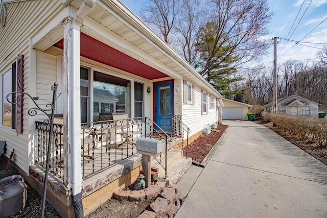 505 S Main St, Edgerton, WI 53534 - exterior space featuring covered porch, an outdoor structure, and a garage