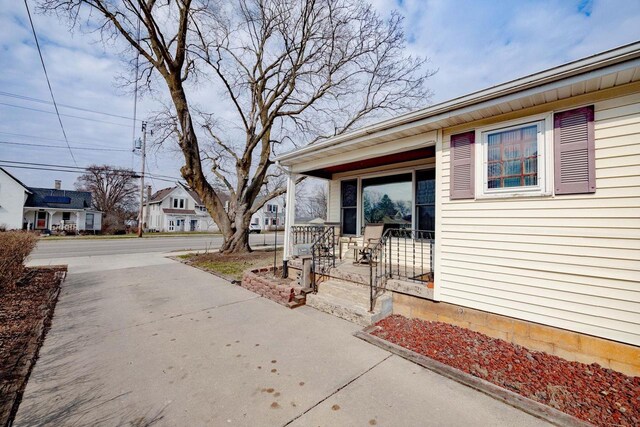 505 S Main St, Edgerton, WI 53534 - property entrance featuring driveway and a porch