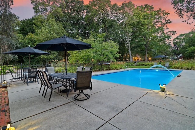 4696 N Lake Dr, Whitefish Bay, WI 53211 - pool at dusk featuring a patio area, fence, and a fenced in pool
