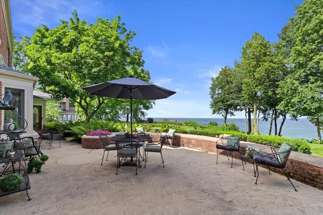 4696 N Lake Dr, Whitefish Bay, WI 53211 - view of patio / terrace featuring outdoor dining space and a water view