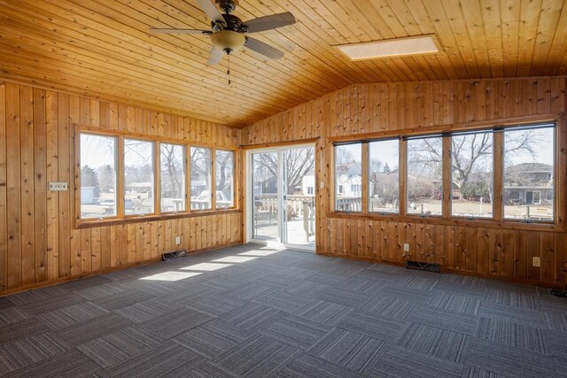 unfurnished sunroom with visible vents and a skylight