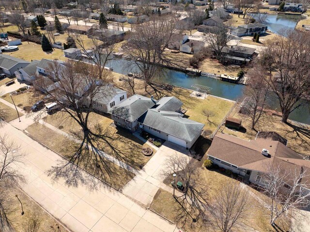 aerial view with a residential view and a water view