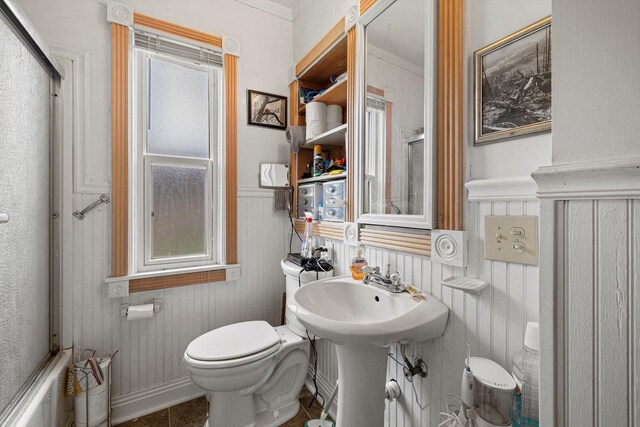 721 N St, Lake Geneva, WI 53147 - bathroom with a wainscoted wall and toilet