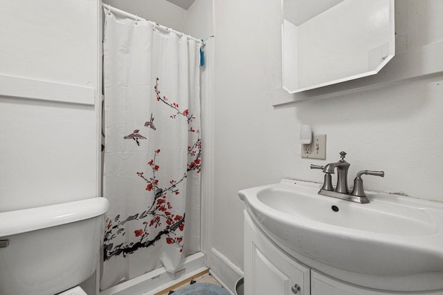 721 N St, Lake Geneva, WI 53147 - bathroom with vanity, toilet, and a shower stall
