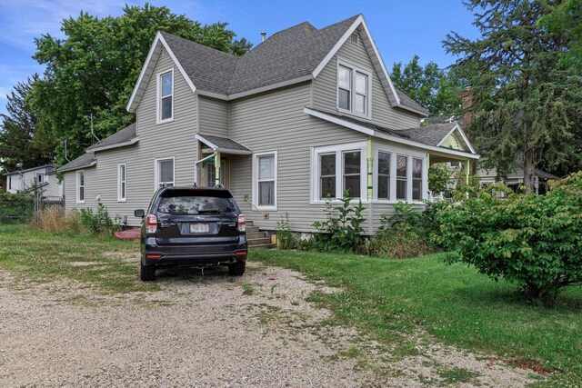 721 N St, Lake Geneva, WI 53147 - view of front facade featuring roof with shingles