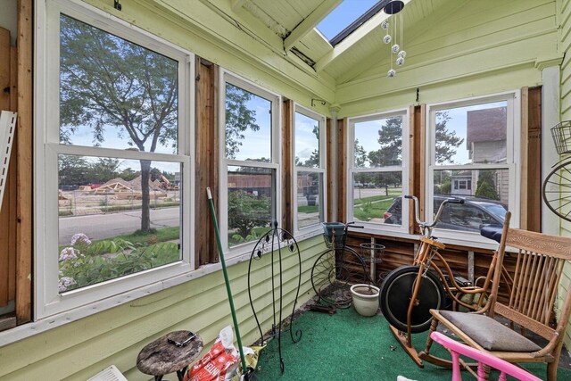721 N St, Lake Geneva, WI 53147 - sunroom / solarium with carpet floors, plenty of natural light, and lofted ceiling with skylight