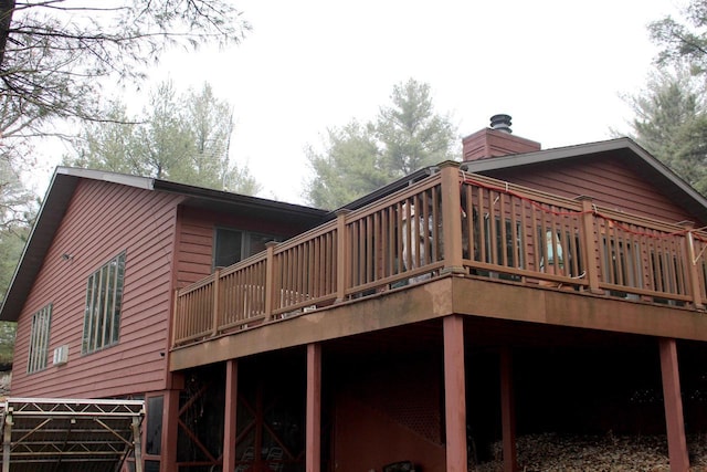 1885 20th Ave, Arkdale, WI 54613 - rear view of house featuring a wooden deck and a chimney
