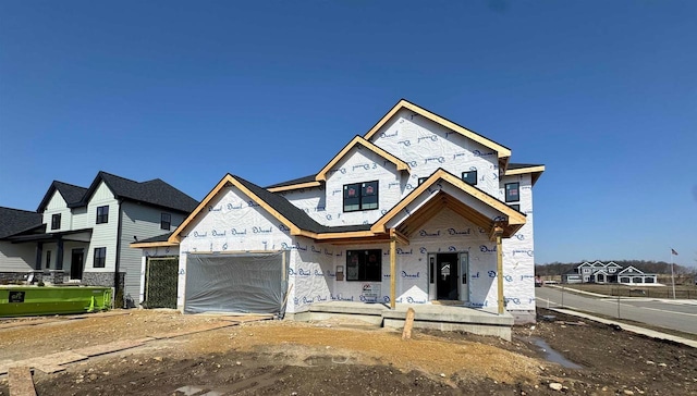 901 Westbridge Ct, Waunakee, WI 53597 - property under construction featuring an attached garage and stone siding