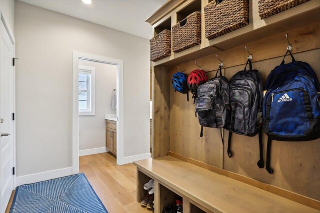 901 Westbridge Ct, Waunakee, WI 53597 - mudroom with light wood-style flooring, baseboards, and recessed lighting
