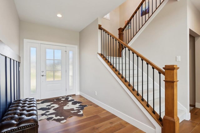 901 Westbridge Ct, Waunakee, WI 53597 - entryway with wood finished floors, baseboards, stairs, and recessed lighting