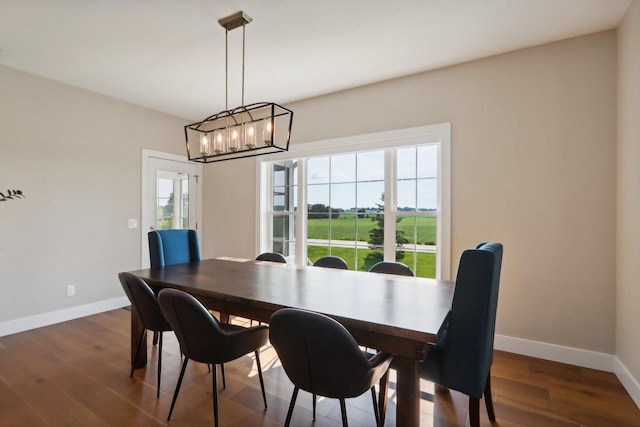 901 Westbridge Ct, Waunakee, WI 53597 - dining area with baseboards, wood finished floors, and a chandelier