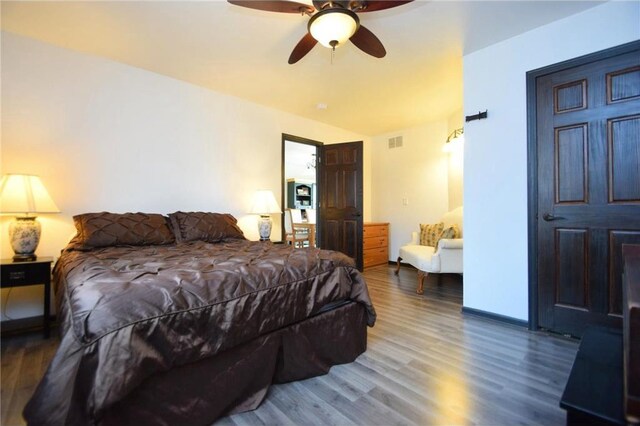8160 Waldora Rd, Siren, WI 54872 - bedroom featuring wood finished floors, ceiling fan, and visible vents