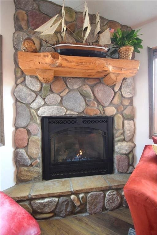 8160 Waldora Rd, Siren, WI 54872 - details with a fireplace and wood finished floors