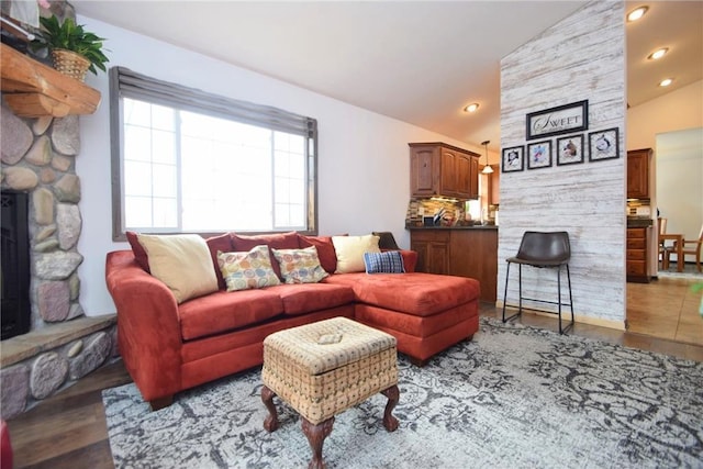 8160 Waldora Rd, Siren, WI 54872 - living area featuring a fireplace, wood finished floors, vaulted ceiling, and recessed lighting