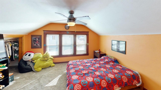 813 Main St, Black River Falls, WI 54615 - bedroom with a closet, ceiling fan, lofted ceiling, carpet floors, and a walk in closet