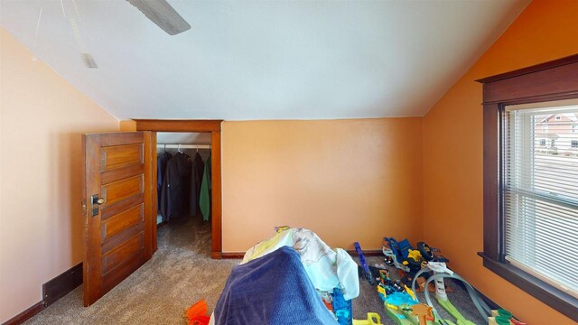813 Main St, Black River Falls, WI 54615 - playroom featuring baseboards, lofted ceiling, and carpet flooring