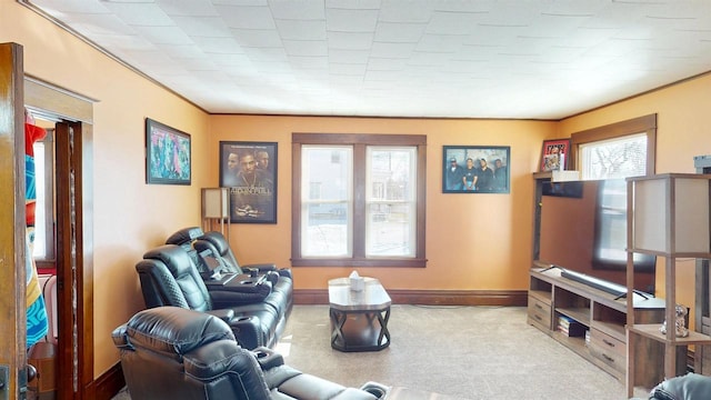 813 Main St, Black River Falls, WI 54615 - carpeted living room featuring ornamental molding and baseboards