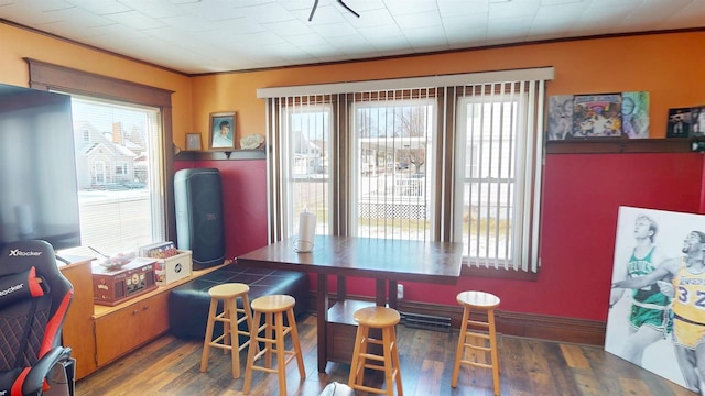 813 Main St, Black River Falls, WI 54615 - dining area with ornamental molding, baseboards, and wood finished floors