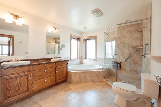 bathroom with a bath, toilet, tile patterned flooring, and a sink